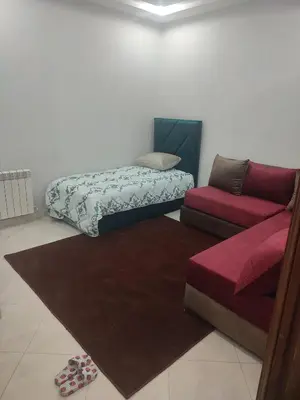 a living room with a bed and a couch at The good stay 1midelt in Midelt