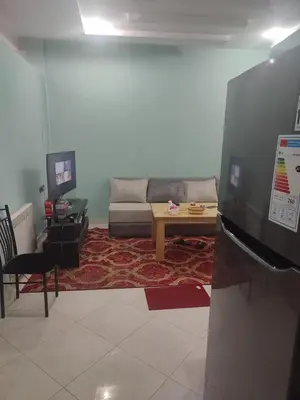 a living room with a couch and a table at The good stay 1midelt in Midelt
