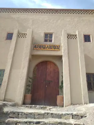 an entrance to a building with a large wooden door at KASBAH Atlas-Aberdouz in Aït Hattab