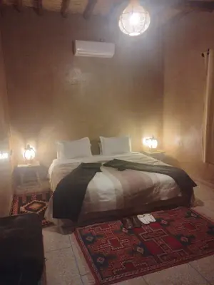 a bedroom with a bed in a room at Gîte Ait lmaalam chez Ahmed in Skoura