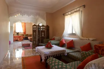 a living room with a couch and a table at villa saada in Marrakech