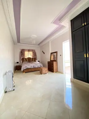 a large bedroom with a bed and a ceiling at Vila Haja - Beautiful Farmhouse with a Private Pool! in Imouzzer Kandar