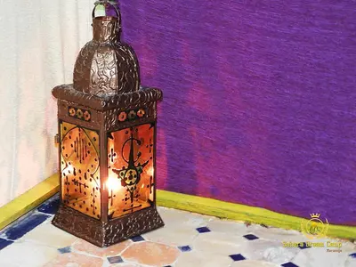 a bottle sitting on top of a stand in a room at Luxury Desert Camp in Merzouga in Tisserdmine