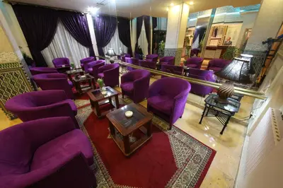 an overhead view of a waiting room with purple chairs at Hotel Akouas in Meknès