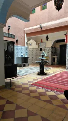 a large room with a table in a building at Riad dar Ahlam in Aït Baha