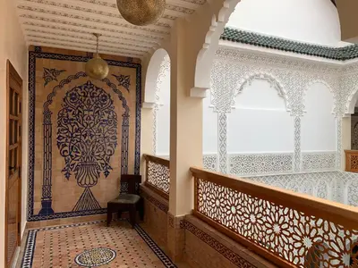 a hallway with an ornate door in a house at Riad Palais Marouane in Meknès