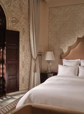 a bedroom with a large white bed and a window at Palais De Fès Suites & Spa in Fès