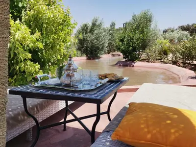 a table with a tray of food on a patio at Soo Bin in Bine el Ouidane