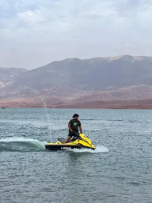 a man on a jet ski in the water at Soo Bin in Bine el Ouidane