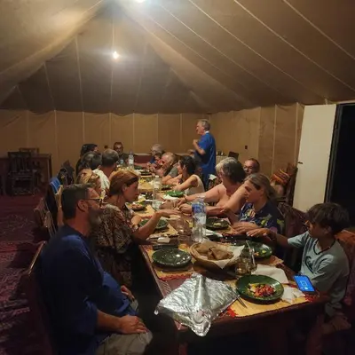a group of people sitting at a table eating at Bivouac ZAGORA in Zagora