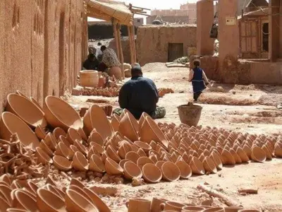 a group of plates sitting on the ground in a street at Bivouac ZAGORA in Zagora