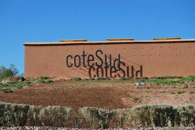 a building with graffiti on the side of it at Côté Sud in Ouarzazate