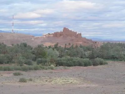 a castle on top of a hill in the desert at Côté Sud in Ouarzazate