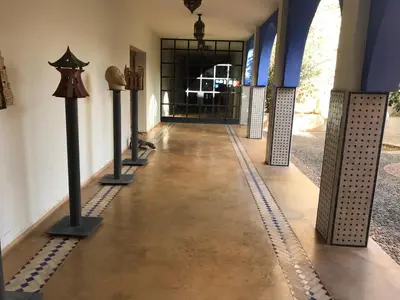 a hallway of a museum with a hallway of exhibits at Côté Sud in Ouarzazate