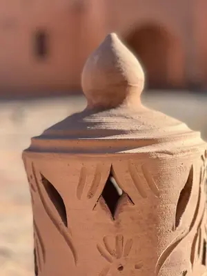 a close up of a clay vase with a lid at Berberbayt lodge maison privé in Tinerhir