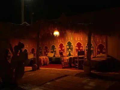 a room with a gingerbread house at night at kasbah planet sahara in Merzouga