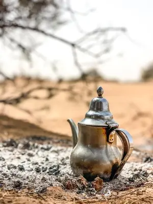 a tea kettle is sitting on the ground at Erg Chegaga Camp & Activites in Mhamid