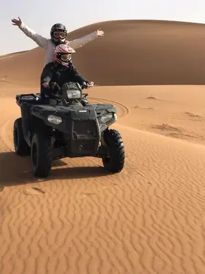 two people on a quad bike in the desert at Erg Chegaga Camp & Activites in Mhamid