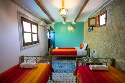 a room with two beds in a room at Riad Dar Rabha in Fès