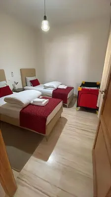 a room with three beds in a room at Suites Appartement Midelt in Midelt