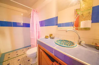 a bathroom with a sink and a toilet at Riad Hayat Fes in Fès