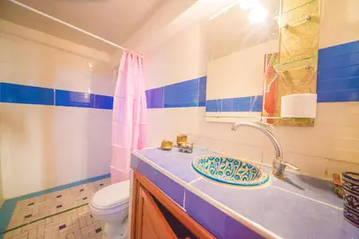 a bathroom with a sink and a toilet at Riad Hayat Fes in Fès