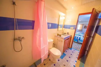 a bathroom with a toilet and a sink and a shower at Riad Hayat Fes in Fès