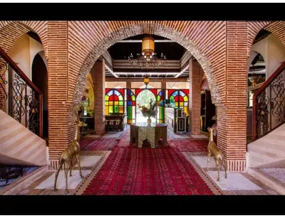 a room with two deer standing in a building at Palace with 2 villas and 2 swimming pools in Sidi Abdellah Ghiat in Had Abdallah Rhiat