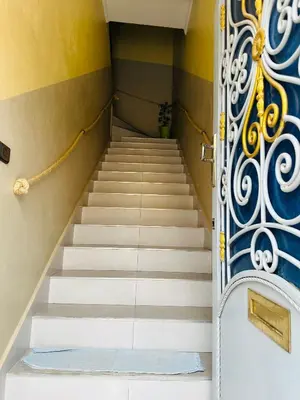 a set of stairs leading up to a door at The Best Stop in Midelt