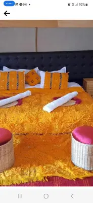 a picture of a bed with utensils on it at Abdo Luxury Camp with Heating in Merzouga