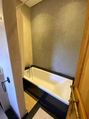 a bathroom with a bath tub in a room at Villa Atlas Secret in Ourika