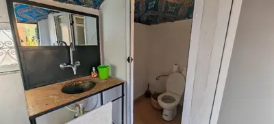 a bathroom with a sink and a toilet at Merzouga Camel Trekking Camp in Merzouga