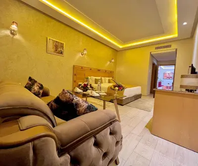 a living room with a couch and a table at Z Hotel Meknes in Meknès