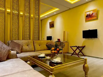 a living room with a couch and a coffee table at Z Hotel Meknes in Meknès