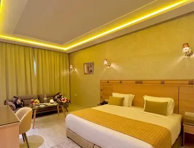 a hotel room with a bed and a couch at Z Hotel Meknes in Meknès
