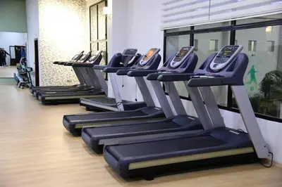 a row of treadmills in a gym at Eventi Club by cité des sports adarissa in Fès