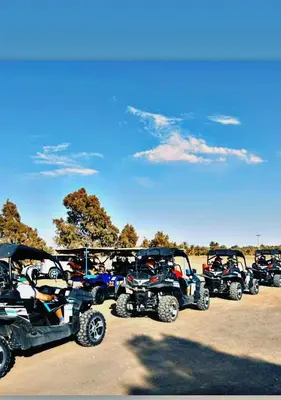 a group of atvs parked in a parking lot at Merzouga apartments holiday in Merzouga