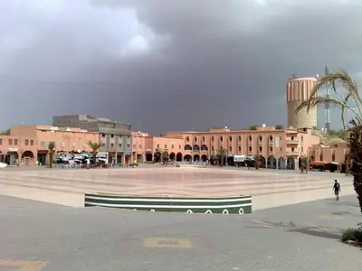 a large plaza in a city with a large building at Hotel Bab Sahara in Ouarzazate