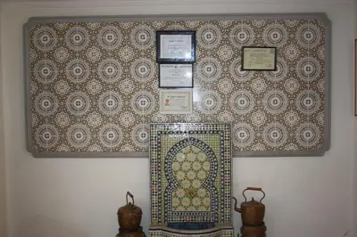 a wall with a moroccan pattern on it at Hotel Bab Sahara in Ouarzazate