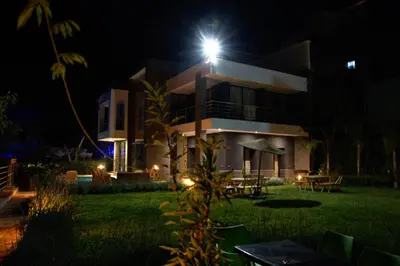 a house with a light on top of it at night at La Perle de l'Ourika in Ourika