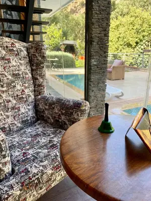 a living room with a couch and a wooden table at La Perle de l'Ourika in Ourika