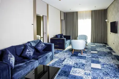 a living room with a couch and a table at Oriental Palace by Agora Complex in Taza