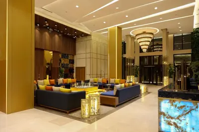 a lobby with couches and tables in a building at Oriental Palace by Agora Complex in Taza