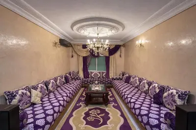 a large living room with a large purple couch at Residence Bouanane B in Fès