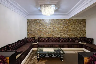 a living room with a couch and a table at Residence Bouanane B in Fès