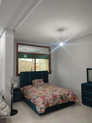 a bedroom with a bed and a large mirror at STOPOVER 1 MIDELT in Midelt