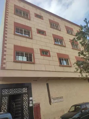 a building with a bunch of windows on it at STOPOVER 1 MIDELT in Midelt
