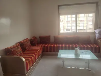 a living room with a couch and a table at STOPOVER 1 MIDELT in Midelt