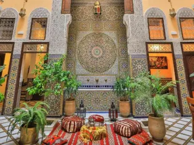 a room with a table with food and plants at Riad Moulaydriss et Giacomo in Fès