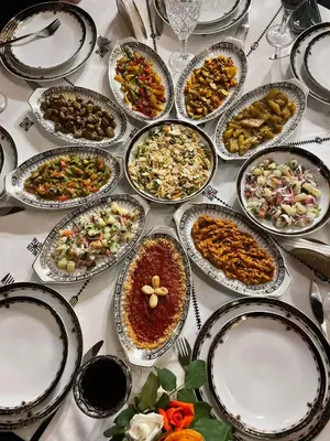 a table with many plates of food on it at Riad Moulaydriss et Giacomo in Fès